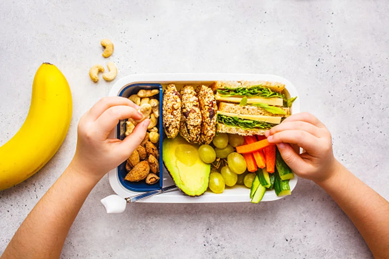 lunchbox with healthy vegetables and sandwiches